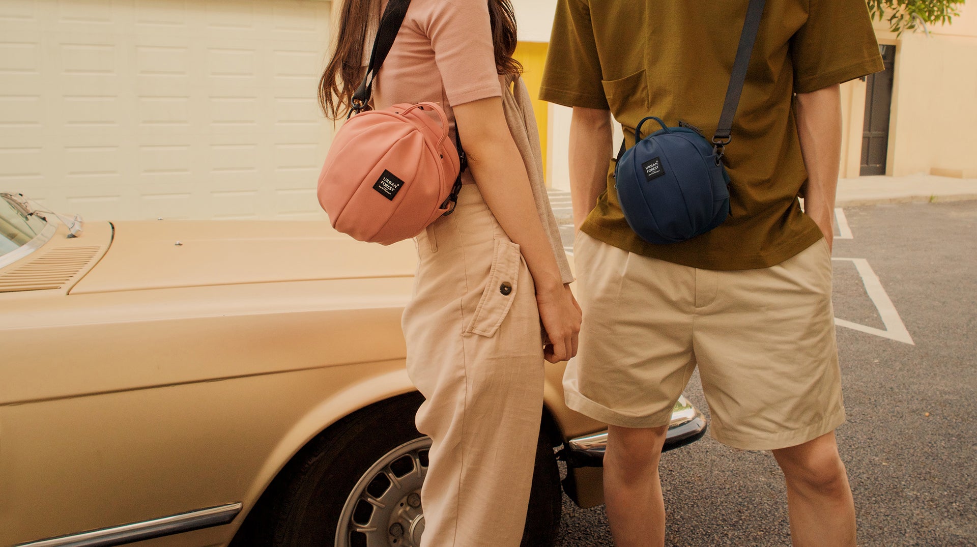 Urban Forest Pink and Navy Beetle Mini Bags in lifestyle street fashion shot