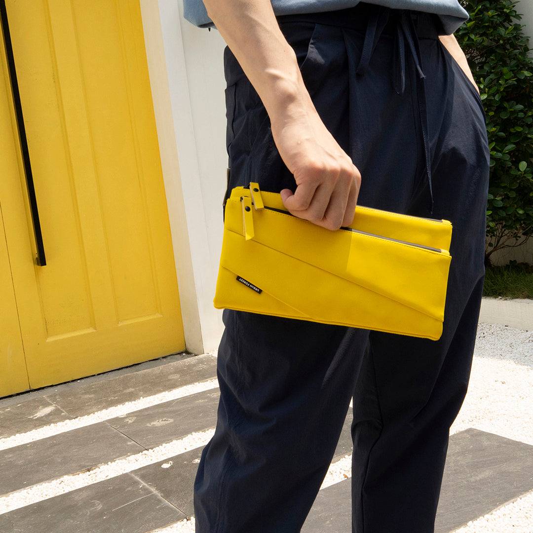 LIGHT Multipurpose Shoulder Bag - Yellow features a detachable shoulder strap, allowing you to wear it crossbody or carry it by hand. 