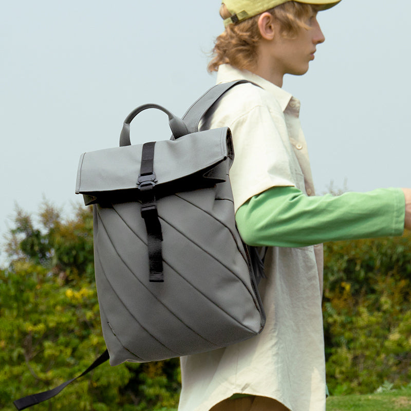 Boy carrying grey colour Urban Forest LIGHT series Laptop rucksack, looks stylish and smart.